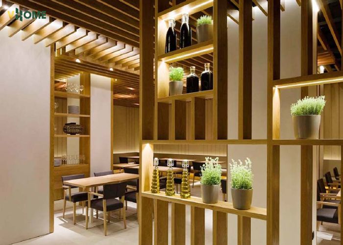 Thanh lam gỗ nhựa làm vách ngăn kết hợp kệ trang trí ở quán café Thanh lam gỗ nhựa làm vách ngăn kết hợp kệ trang trí ở quán café