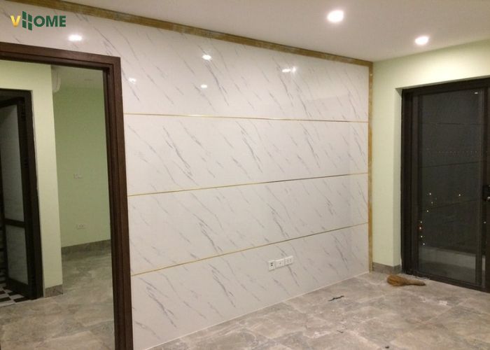 Tấm ốp tường giả đá được thi công ở phòng khách Tấm ốp tường giả đá được thi công ở phòng khách